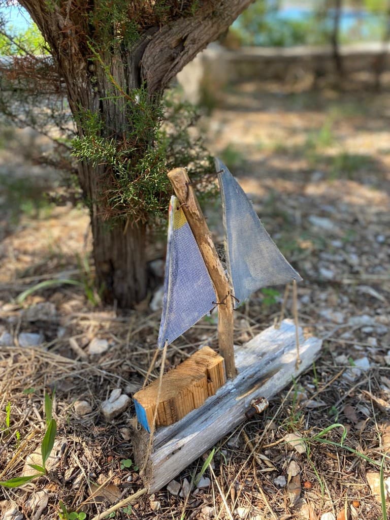 Handmade driftwood sailboat